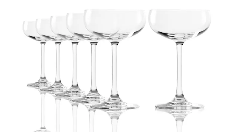 Assorted ribbed wine glasses filled with wine on a dining table Assorted ribbed wine glasses filled with wine on a dining table