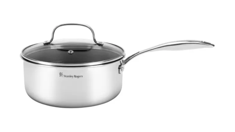 Side view of a saucepan showcasing an ergonomic handle and a glass cover Side view of a saucepan showcasing an ergonomic handle and a glass cover