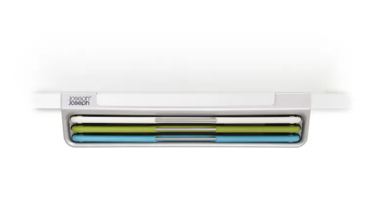 Under-shelf-mounted slim case holding three colour-coded chopping boards Under-shelf-mounted slim case holding three colour-coded chopping boards