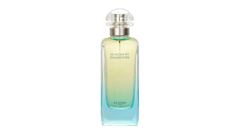 Back view of the Hermès Un Jardin en Méditerranée perfume bottle showing the translucent gradient glass Back view of the Hermès Un Jardin en Méditerranée perfume bottle showing the translucent gradient glass