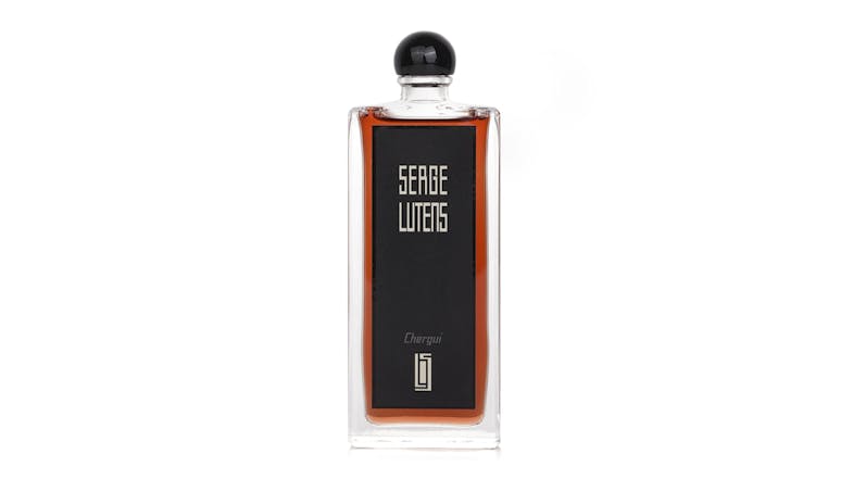 Front view of a Serge Lutens Chergui perfume bottle with amber liquid Front view of a Serge Lutens Chergui perfume bottle with amber liquid