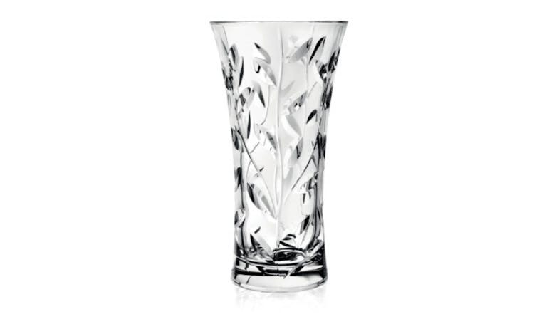 Clear crystal vase with a flared rim and intricate laurel leaf pattern etched along the body Clear crystal vase with a flared rim and intricate laurel leaf pattern etched along the body