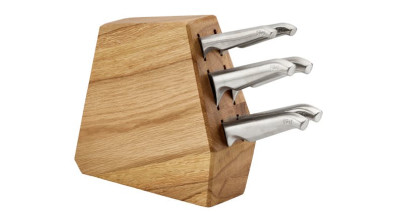 Wooden knife block holding three stainless steel knives with curved handles Wooden knife block holding three stainless steel knives with curved handles