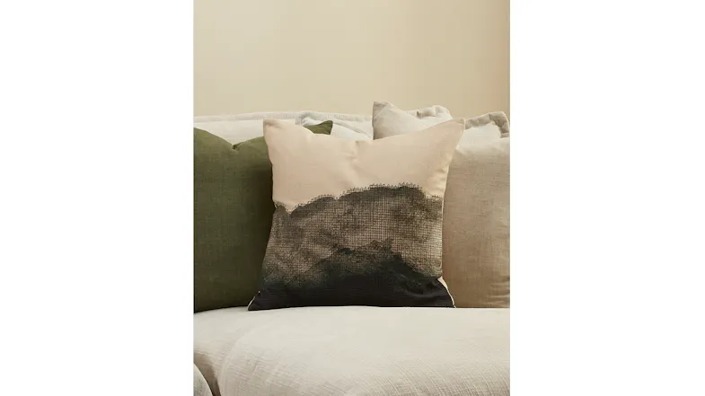 A close up view of the cushion displayed on a sofa A close up view of the cushion displayed on a sofa