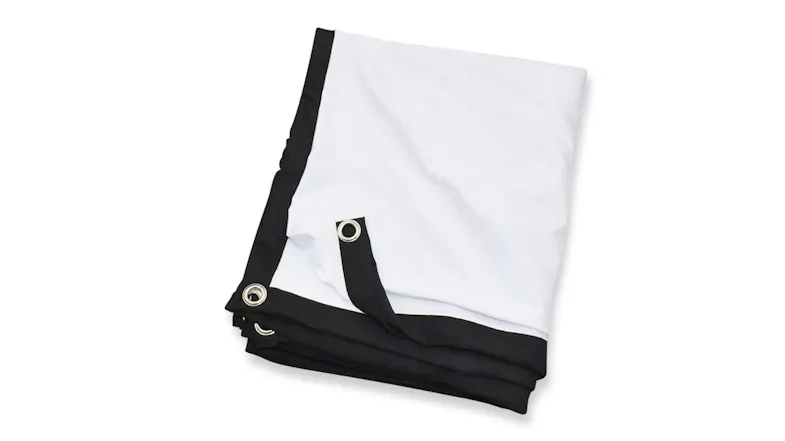 A close-up angled view of a folded white projector screen with a black border and metal grommets A close-up angled view of a folded white projector screen with a black border and metal grommets