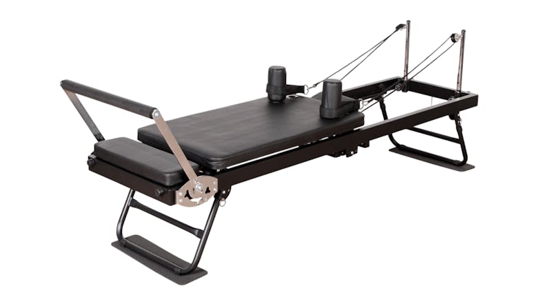 Full view of the metal frame PROTRAIN Reformer Pilates machine with headrest Full view of the metal frame PROTRAIN Reformer Pilates machine with headrest