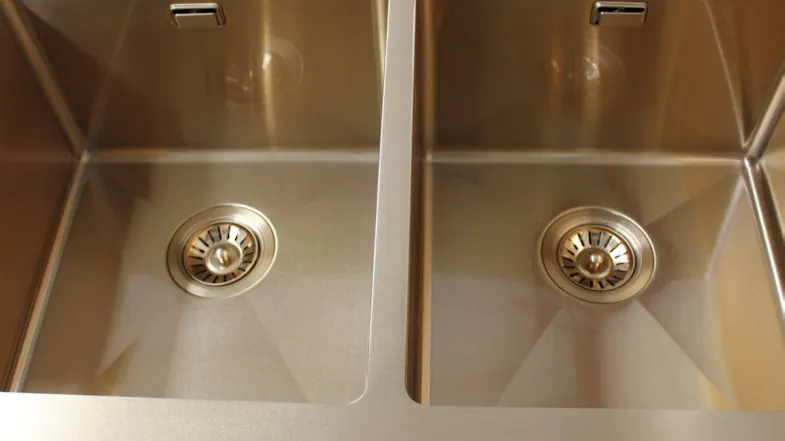 A close-up of the gold stainless steel sink drain strainer A close-up of the gold stainless steel sink drain strainer