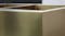 Detailed view of a gold stainless steel kitchen sink corner with brushed texture and sharp edges Detailed view of a gold stainless steel kitchen sink corner with brushed texture and sharp edges
