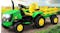 A TSB Living Ride On Car Tractor and Trailer in green and yellow, with large wheels and an attached cargo trailer A TSB Living Ride On Car Tractor and Trailer in green and yellow, with large wheels and an attached cargo trailer