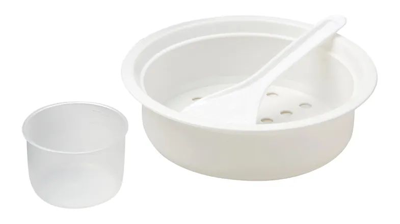 White plastic rice cooker accessories including a bowl, strainer insert, rice paddle, and measuring cup White plastic rice cooker accessories including a bowl, strainer insert, rice paddle, and measuring cup