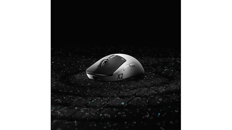 Profile view of the Logitech G Pro X2 mouse on a textured dark surface Profile view of the Logitech G Pro X2 mouse on a textured dark surface