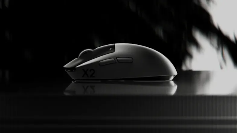 Profile of Logitech gaming mouse with "X2" text on a dark, reflective surface Profile of Logitech gaming mouse with "X2" text on a dark, reflective surface
