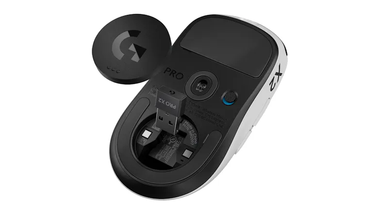 Underside view of a mouse with the magnetic puck removed to show the USB dongle slot Underside view of a mouse with the magnetic puck removed to show the USB dongle slot