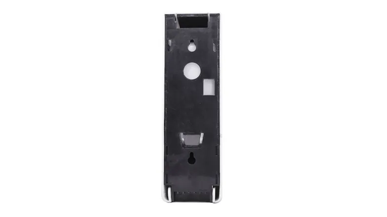 Rear view of the soap dispenser exposing the internal mounting plate with keyhole slots for wall installation Rear view of the soap dispenser exposing the internal mounting plate with keyhole slots for wall installation