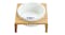 Elevated bamboo pet feeder holding a white ceramic bowl with a fishbone graphic Elevated bamboo pet feeder holding a white ceramic bowl with a fishbone graphic