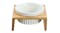 Profile view of the Pet Ceramic Bowl placed on a raised bamboo stand Profile view of the Pet Ceramic Bowl placed on a raised bamboo stand
