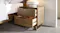 The bedside table with its drawers slightly pulled out The bedside table with its drawers slightly pulled out