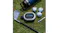 JLab Pop Party speaker shown with golf accessories in a sunny outdoor setting JLab Pop Party speaker shown with golf accessories in a sunny outdoor setting