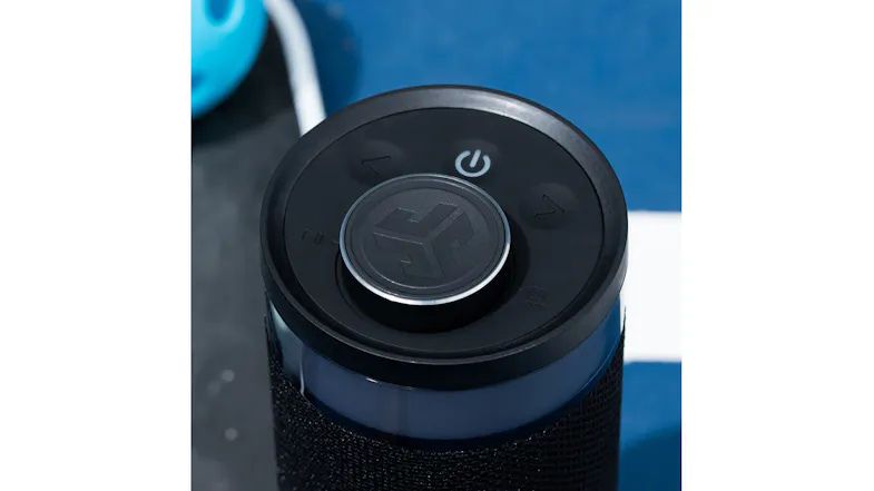 Top view of the JLab Go Party speaker showing the power button, volume controls, and logo Top view of the JLab Go Party speaker showing the power button, volume controls, and logo