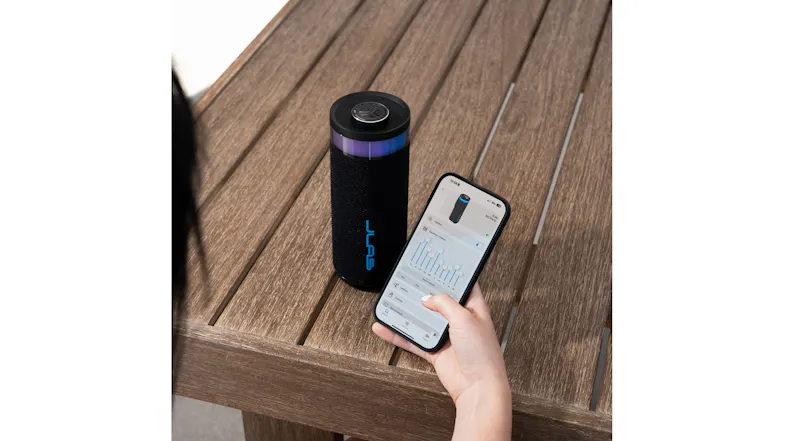 Person using the JLab app on a smartphone to adjust the EQ settings of the Go Party speaker Person using the JLab app on a smartphone to adjust the EQ settings of the Go Party speaker