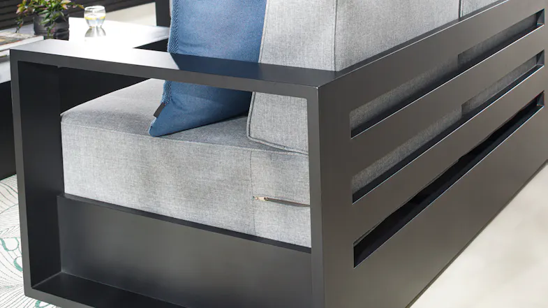 Close‑up of the Monaco sofa’s grey cushion fabric, highlighting the fine woven texture and smooth edge piping Close‑up of the Monaco sofa’s grey cushion fabric, highlighting the fine woven texture and smooth edge piping