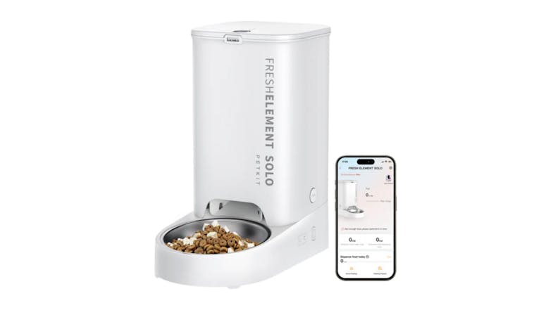 White automatic pet feeder with a bowl of kibble, shown next to a smartphone displaying its control app White automatic pet feeder with a bowl of kibble, shown next to a smartphone displaying its control app