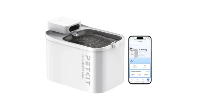 White PetKit pet water fountain with flowing water beside a smartphone displaying its control app White PetKit pet water fountain with flowing water beside a smartphone displaying its control app