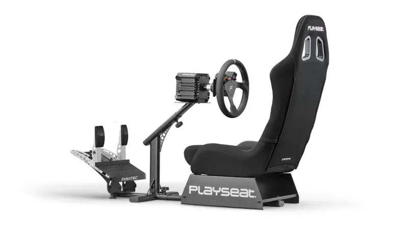 Angled side view of the Playseat Evolution ActiFit seat with a direct‑drive style wheel base and pedal set Angled side view of the Playseat Evolution ActiFit seat with a direct‑drive style wheel base and pedal set