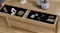Top drawer of the Arc Lowboy open, showing a black felt-lined jewelry organiser with rings and gems Top drawer of the Arc Lowboy open, showing a black felt-lined jewelry organiser with rings and gems