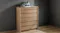 Angled profile of the Arc 6 Drawer Tallboy showing its sleek, curved wooden silhouette Angled profile of the Arc 6 Drawer Tallboy showing its sleek, curved wooden silhouette