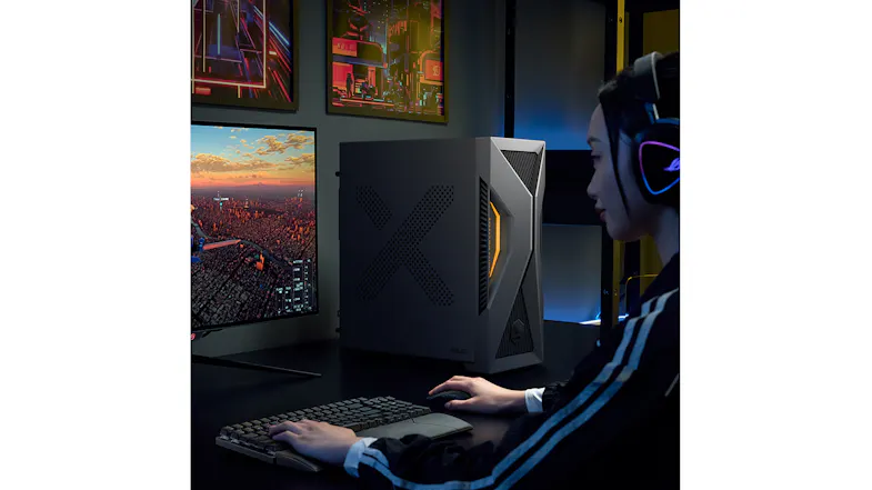 Side profile of a gamer using the PC at a desk with a monitor Side profile of a gamer using the PC at a desk with a monitor