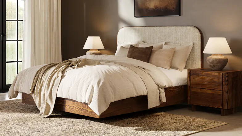 A full view of a bed with the upholstered headboard attached A full view of a bed with the upholstered headboard attached