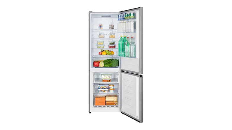 Fully stocked refrigerator with food in both compartments Fully stocked refrigerator with food in both compartments