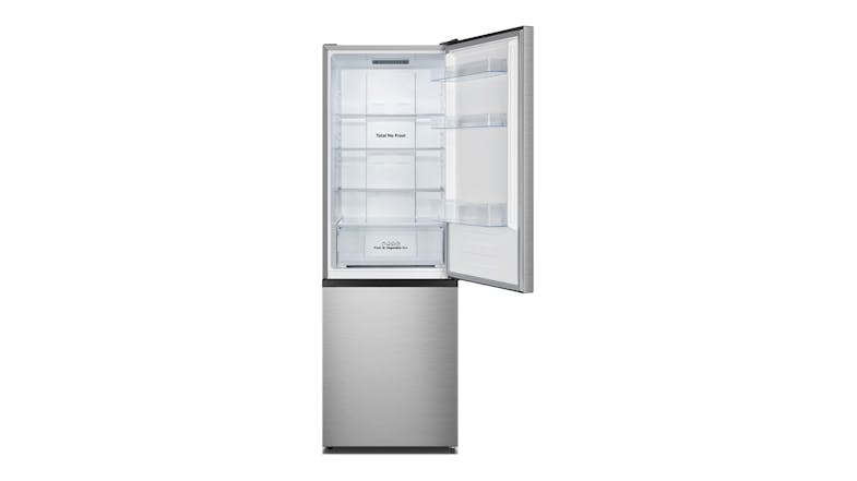 An open upper fridge door showing empty glass shelves and a crisper An open upper fridge door showing empty glass shelves and a crisper