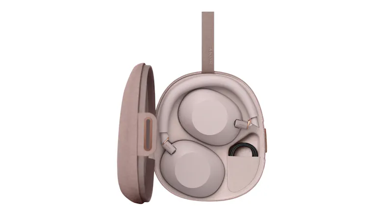 The sand Sony over-ear headphones neatly packed inside their hard-shell carrying case The sand Sony over-ear headphones neatly packed inside their hard-shell carrying case