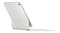 Rear angled view of a white keyboard with Apple logo Rear angled view of a white keyboard with Apple logo