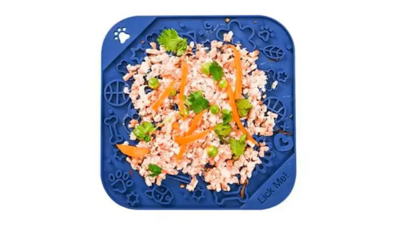 Blue Fluff n' Stuff Enrichment Lick Mat topped with minced food, carrot strips, peas, and herbs Blue Fluff n' Stuff Enrichment Lick Mat topped with minced food, carrot strips, peas, and herbs