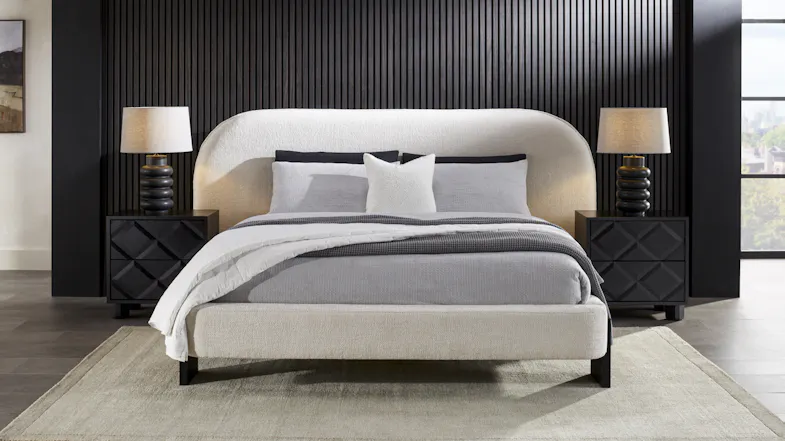Front view of the upholstered bed with symmetrical nightstands Front view of the upholstered bed with symmetrical nightstands