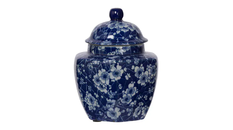 A large porcelain jar with a rounded body and domed lid, finished in white and blue floral patterns A large porcelain jar with a rounded body and domed lid, finished in white and blue floral patterns