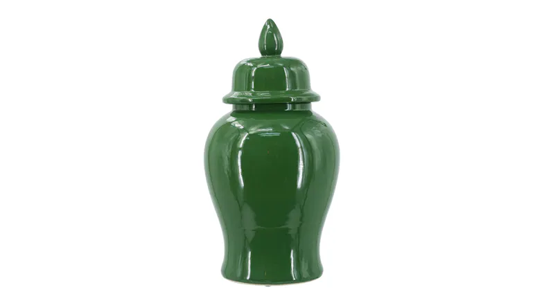 A 48cm glossy green porcelain ginger jar with a domed lid and pointed finial A 48cm glossy green porcelain ginger jar with a domed lid and pointed finial