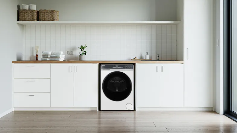 Haier 8kg heat pump dryer in a modern kitchen setting Haier 8kg heat pump dryer in a modern kitchen setting