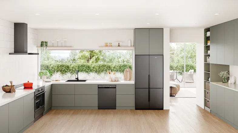 A kitchen featuring the Westinghouse Quad Door Fridge Freezer in matte charcoal black, built into cabinetry A kitchen featuring the Westinghouse Quad Door Fridge Freezer in matte charcoal black, built into cabinetry