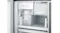 A view of the automatic ice maker inside the freezer section, showing a transparent ice bin filled with ice cubes A view of the automatic ice maker inside the freezer section, showing a transparent ice bin filled with ice cubes