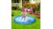 A dog playing on a splash pad in a garden with water spraying around A dog playing on a splash pad in a garden with water spraying around