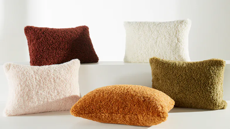 A collection of soft Shetland cushions by Linen House in various earthy, textured tones A collection of soft Shetland cushions by Linen House in various earthy, textured tones