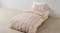Sailor Stripe Pink Duvet Cover Set by Linen House Kids on a single bed in a bright room Sailor Stripe Pink Duvet Cover Set by Linen House Kids on a single bed in a bright room