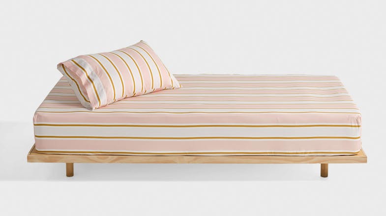 Sailor Stripe Pink Fitted Sheet Set by Linen House Kids on a wooden platform bed Sailor Stripe Pink Fitted Sheet Set by Linen House Kids on a wooden platform bed