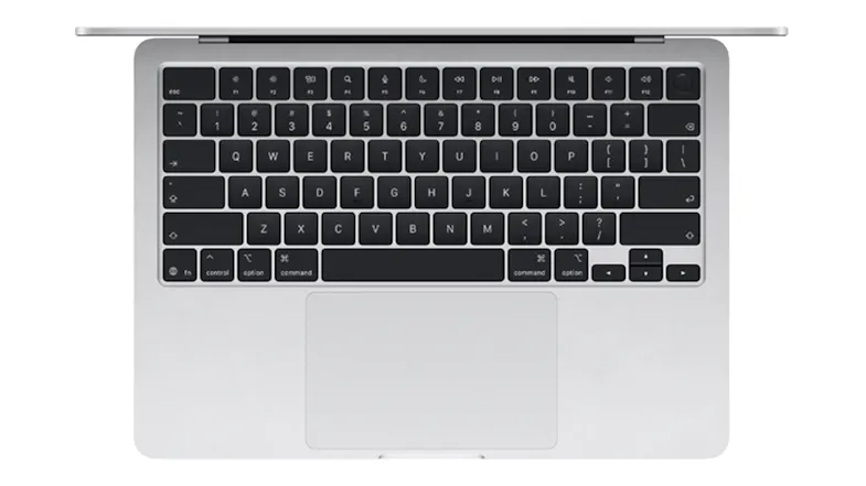 Overhead view of the silver MacBook Air’s keyboard, Magic Trackpad, and Touch ID sensor Overhead view of the silver MacBook Air’s keyboard, Magic Trackpad, and Touch ID sensor