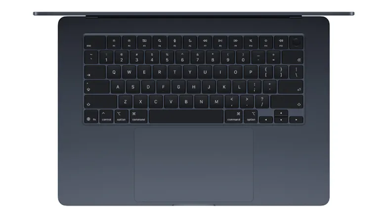Top-down view of the midnight MacBook Air keyboard and large trackpad, showing the full key layout Top-down view of the midnight MacBook Air keyboard and large trackpad, showing the full key layout