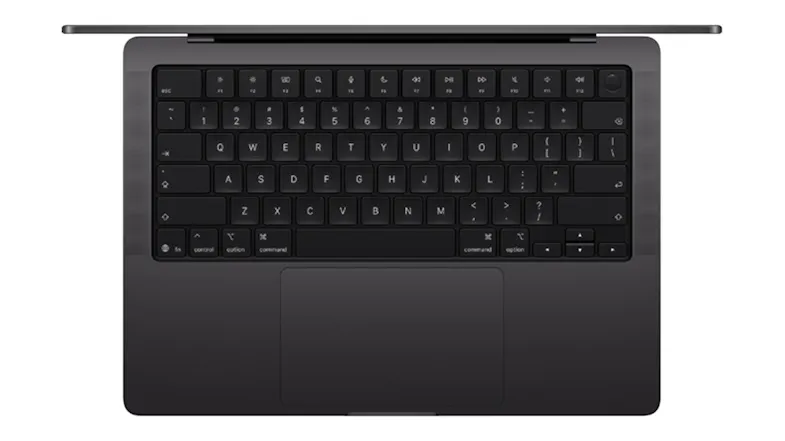 Top‑down view of the MacBook Pro keyboard and large trackpad, highlighting the keys and space black body Top‑down view of the MacBook Pro keyboard and large trackpad, highlighting the keys and space black body